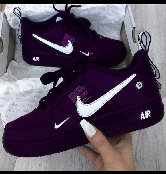 black nike shoes with purple swoosh