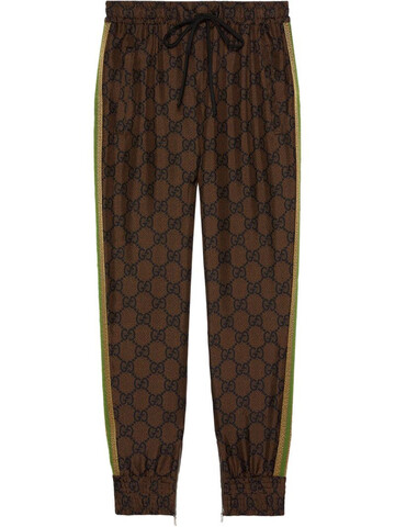 Gucci GG Supreme print track pants in brown