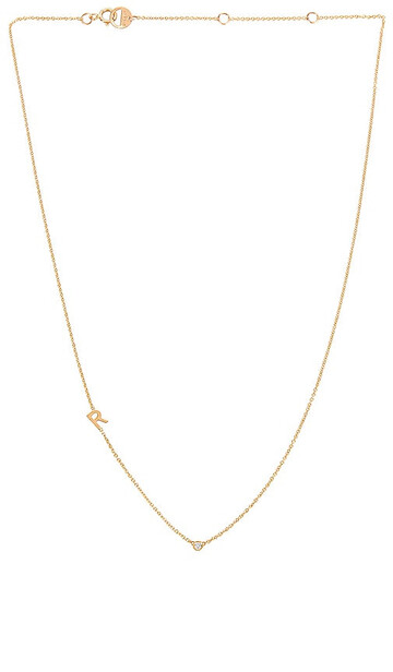 BYCHARI Asymmetrical Initial & Diamond Necklace in Metallic Gold in yellow