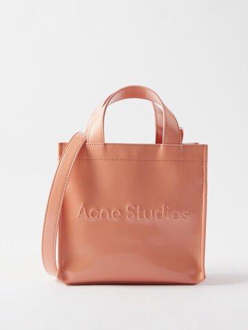 acne studios - logo-embossed faux leather cross-body bag - womens - light pink